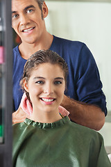 Image showing Male Hairdresser Wiping Client's Hair