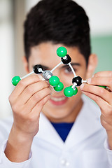Image showing Teenage Schoolboy Analyzing Molecular Structure