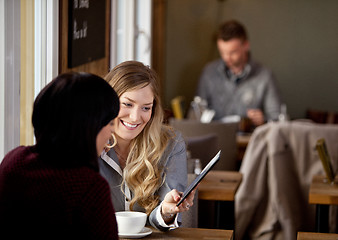 Image showing Woman Showing Digital Tablet to Friend