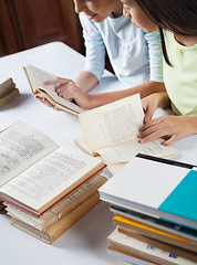 Image showing Schoolgirls Reading Books At Table In Library