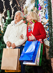 Image showing Senior Couple Shopping In Christmas Store