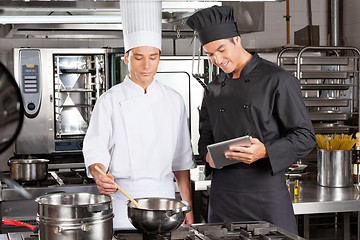 Image showing Chefs Preparing Food In Kitchen