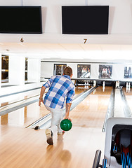 Image showing Man Going For The Last Pin in Bowling Alley