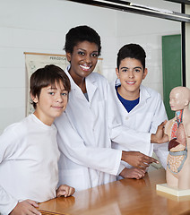 Image showing Teacher Pointing At Anatomical Model With Students At Desk