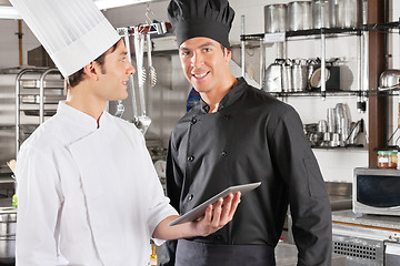 Image showing Chef With Colleague Holding Digital Tablet