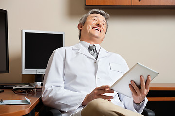 Image showing Cheerful Doctor Holding Digital Tablet