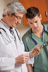 Image showing Medical Professionals Looking At Medicine Box