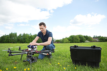 Image showing Engineer Fixing UAV Drone in Park