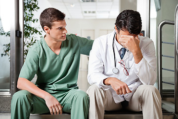 Image showing Colleague Comforting Upset Doctor