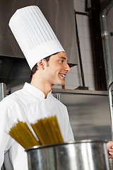Image showing Young Male Chef Standing In Kitchen