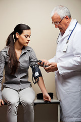 Image showing Doctor Taking Woman's Blood Pressure