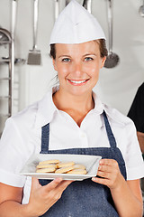 Image showing Happy Female Chef Presenting Cookies