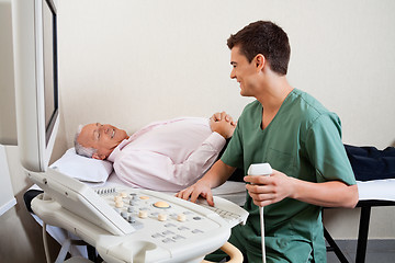 Image showing Radiologic Technician Smiling At Patient