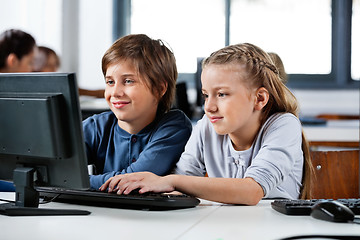 Image showing Boy And Girl Using Desktop Pc In School Computer Lab