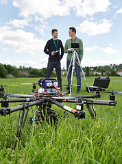 Image showing UAV Helicopter And Technicians At Park