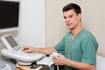 Image showing Technician Operating Ultrasound Machine