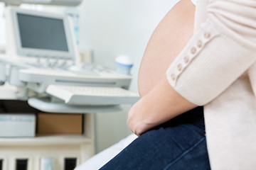 Image showing Pregnant Woman In Clinic Before Ultrasound