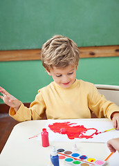 Image showing Boy Painting With Watercolors In Art Class