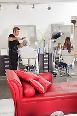 Image showing Hairdresser Styling Customer's Hair At Parlor