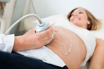 Image showing Female Doctor Scanning Pregnant Woman's Belly