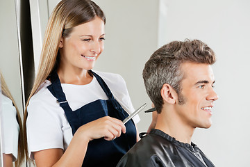 Image showing Hairdresser Cutting Customer's Hair