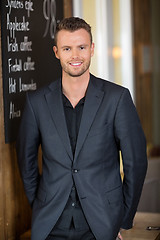 Image showing Young Businessman Standing In Restaurant