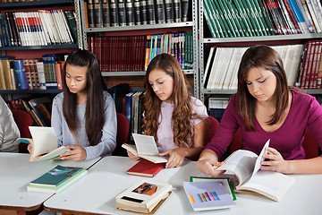 Image showing Schoolgirls Reading Books In Library