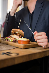 Image showing Businessman Eating Food In Restaurant