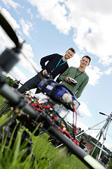 Image showing Technicians With Remote Controls Of UAV