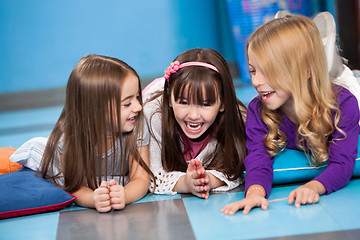 Image showing Little Girls Laughing While Lying On Floor