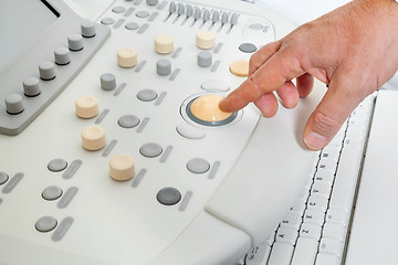 Image showing Hand Operating Ultrasound Machine