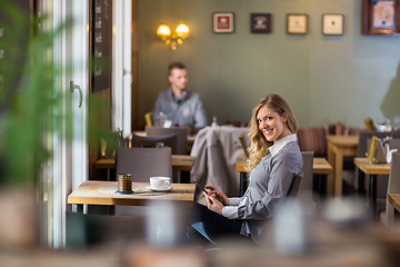 Image showing Pregnant Woman Using Digital Tablet At Coffeeshop