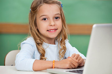 Image showing Girl With Laptop At Classroom Desk