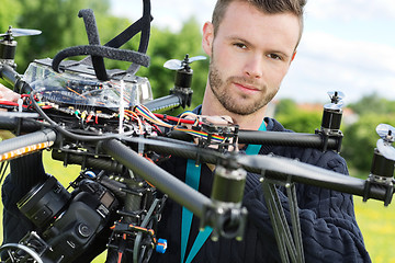 Image showing Male Engineer With UAV Helicopter in Park