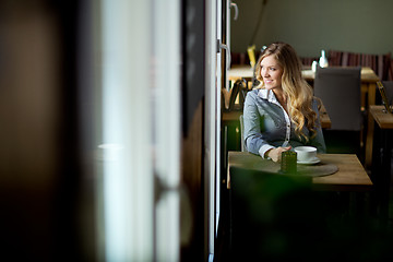 Image showing Attractive Woman Alone in Cafe