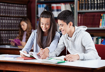 Image showing Teenage Couple Studying Together In Library