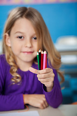 Image showing Girl Holding Color Pencils In Kindergarten