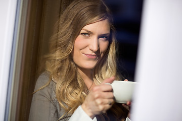 Image showing Attractive Woman Holding Cup At Cafe
