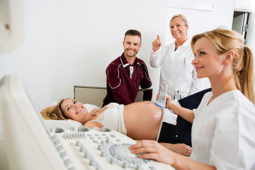 Image showing Couple And Doctors Looking At Ultrasound