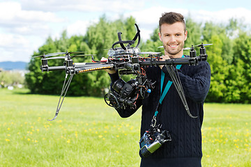 Image showing Technician Holding UAV Octocopter in Park