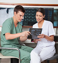 Image showing Medical Technicians Discussing About X-ray