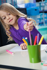 Image showing Girl Picking Sketch Pen From Case In Classroom