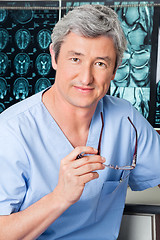 Image showing Doctor Holding Glasses