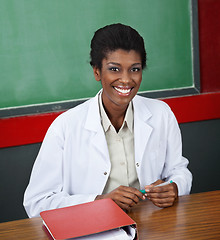 Image showing Confident Female Professor Sitting At Desk