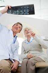 Image showing Radiologist And Patient Looking At X-ray