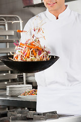 Image showing Chef Flipping Vegetables in Wok