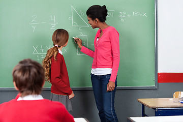 Image showing Teacher Teaching Mathematics To Students On Board