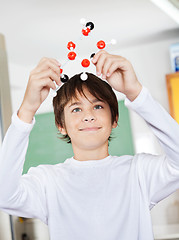 Image showing Schoolboy Examining Molecular Structure In Classroom