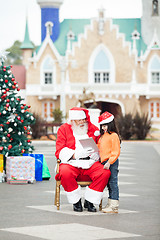 Image showing Santa Claus Showing Digital Tablet To Girl