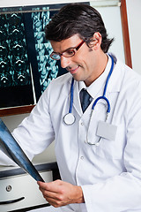 Image showing Male Radiologist Reviewing X-ray